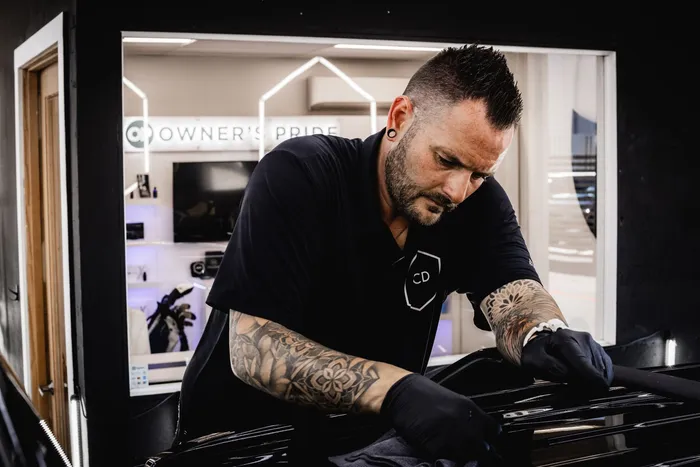 Dustin Wharton performing paint correction in the OCD studio